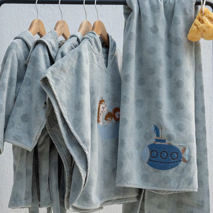 Baby bathrobes, ponchos and sleeping bags on a rail, from our own line in Denizli
